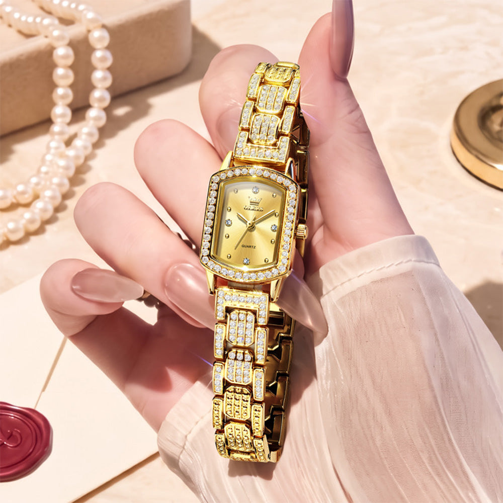 Gold tone OLEVS 7142 women's quartz watch displayed in hand - OLEVS 7142