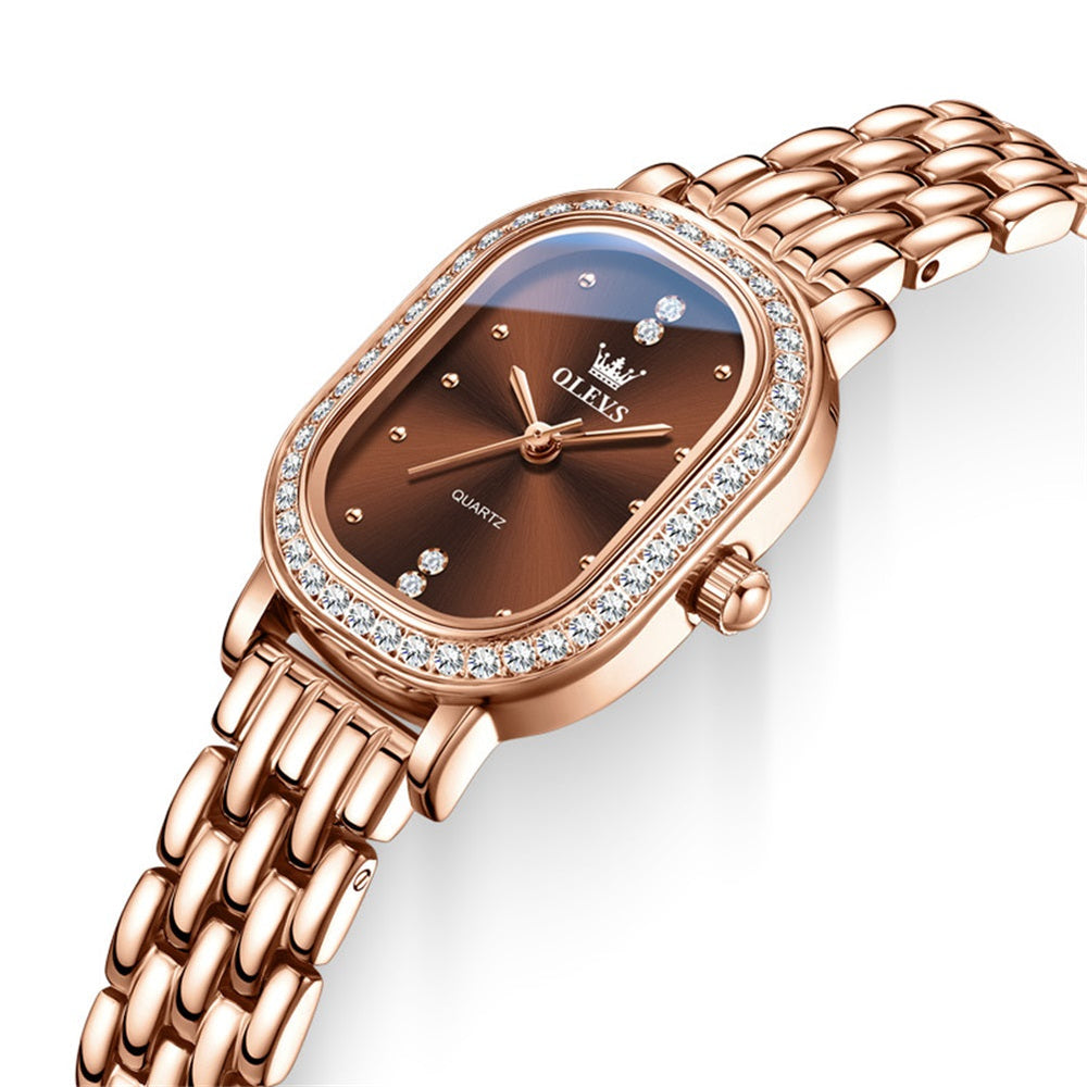Rose gold tone steel bracelet and brown dial closeup - OLEVS 5697