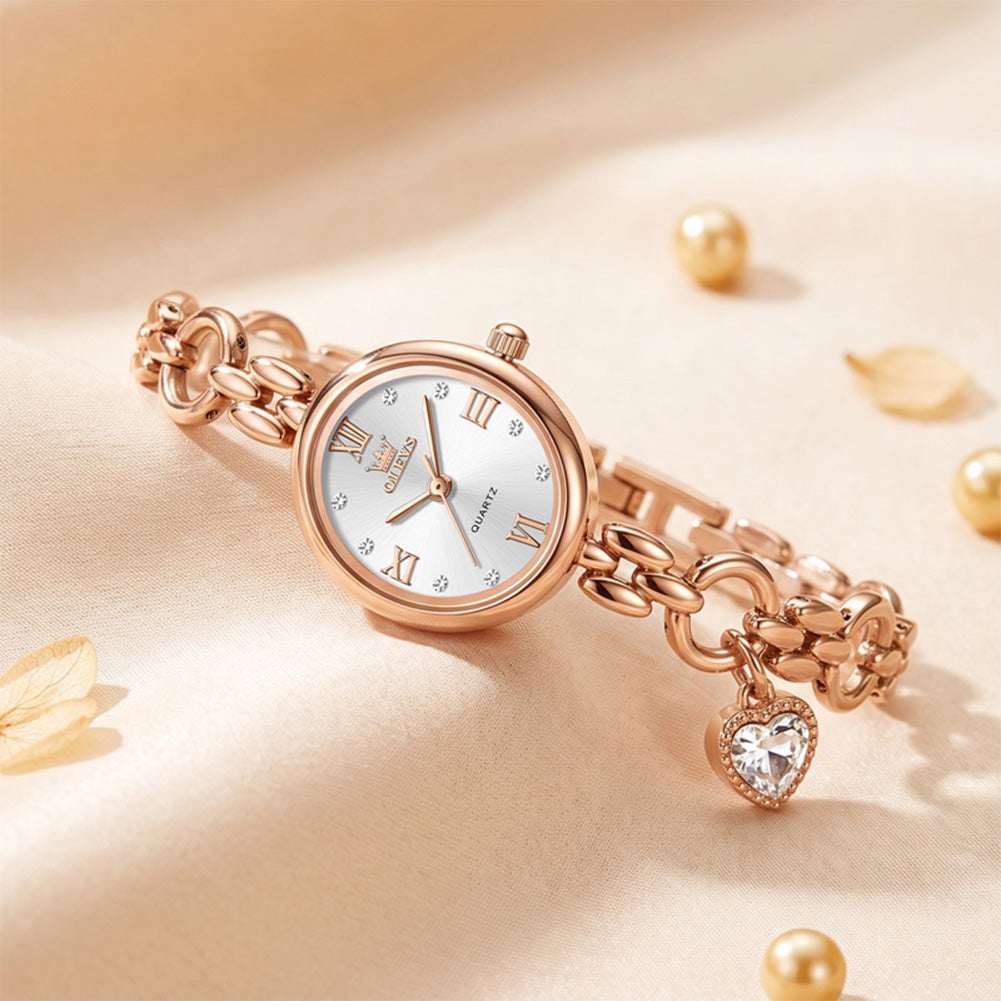 Oval watch and heart charm on a fabric background - OLEVS 5702