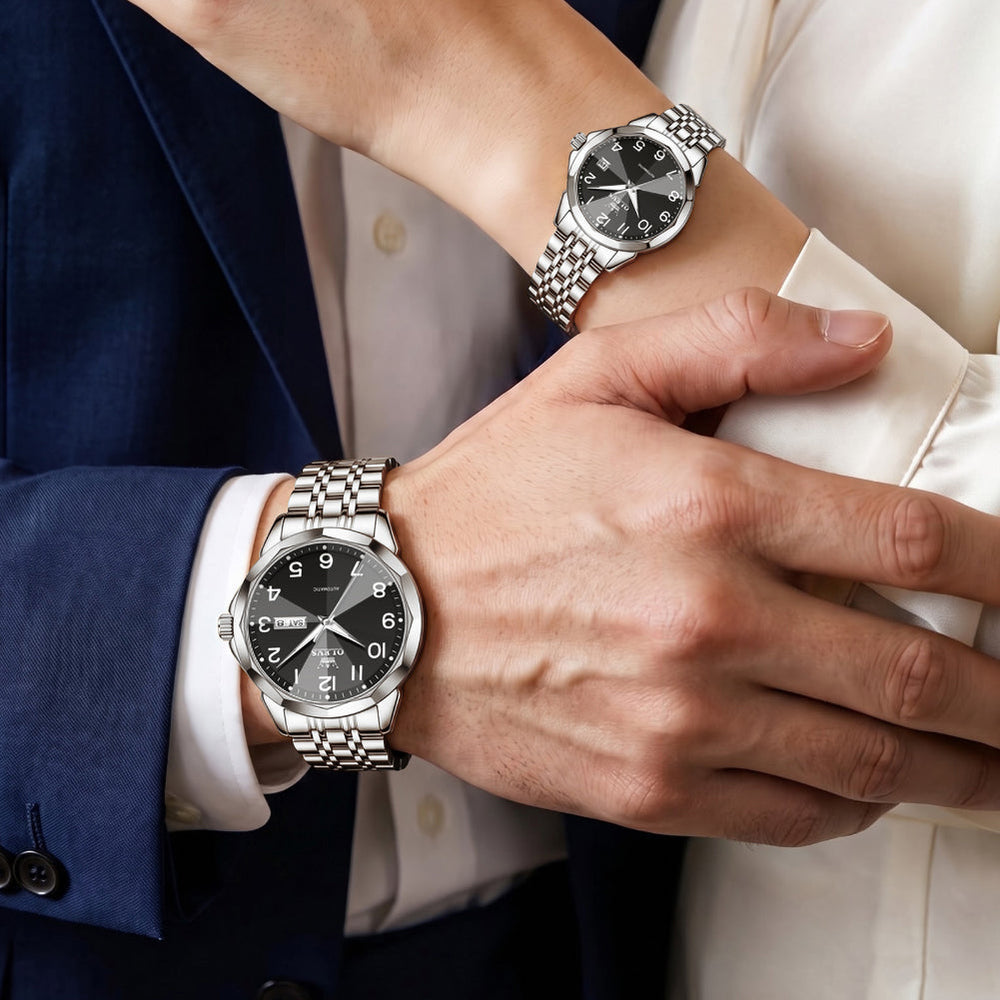 silver black matching watches worn by a couple - OLEVS 6789