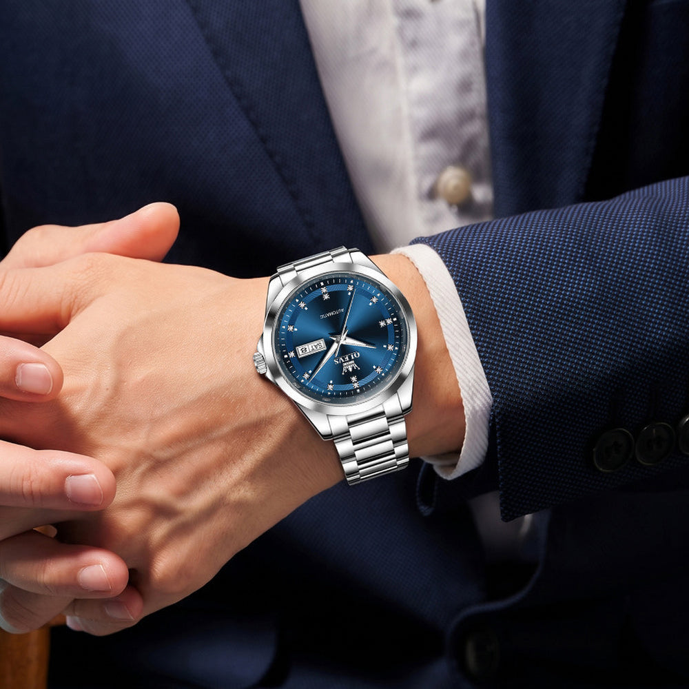 Silver Blue watch worn with suit - OLEVS 7136