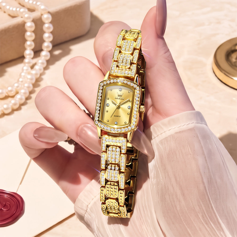 Gold tone OLEVS 7142 women's quartz watch displayed in hand - OLEVS 7142