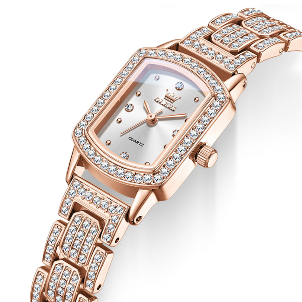 Angled view of OLEVS 7142 rose gold quartz watch showing coated glass and crystal accented bezel - OLEVS 7142